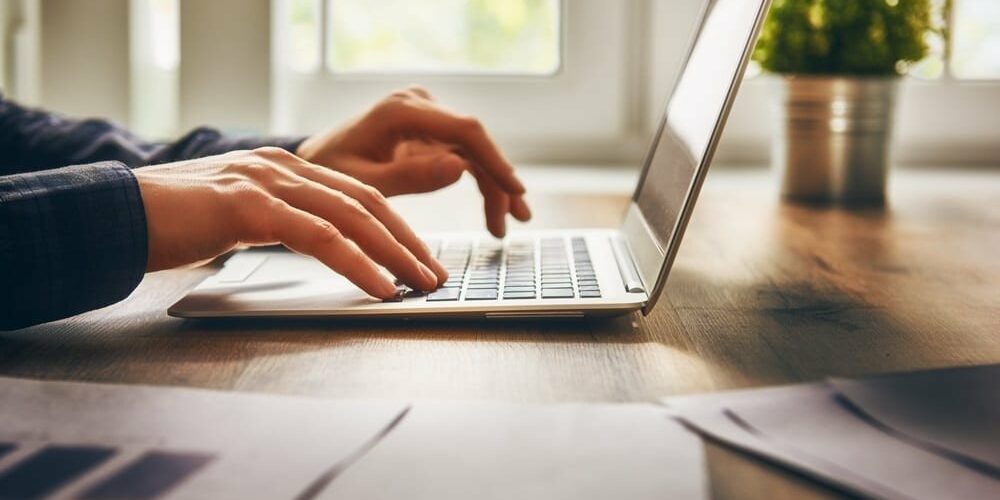 Woman using Laptop with graphs