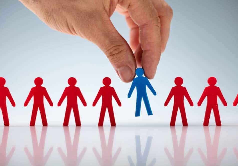 Hand picking out the ideal customer from a long line of possibilities
