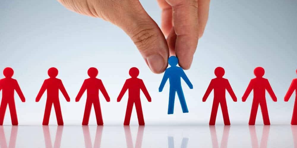 Hand picking out the ideal customer from a long line of possibilities