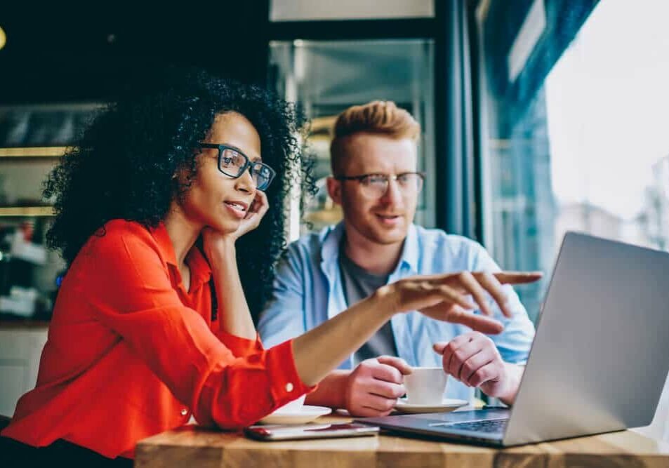 working in computer during collaboration with colleague