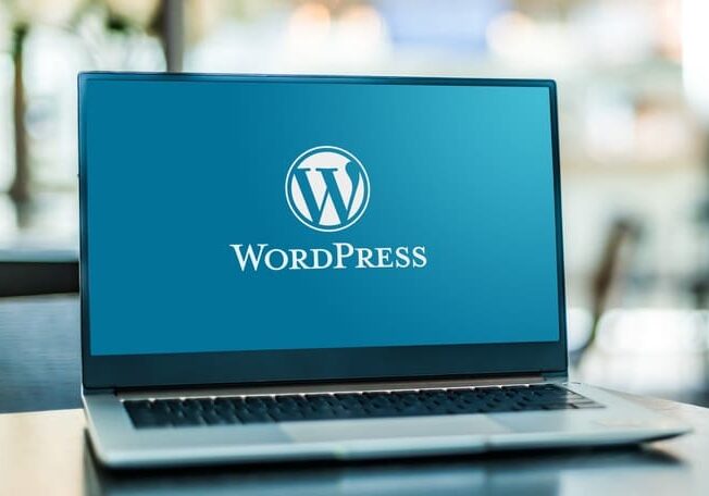 Laptop displaying logo of WordPress