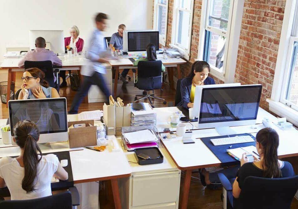 Busy Design Office With Workers At Desks