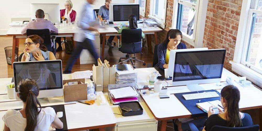Busy Design Office With Workers At Desks