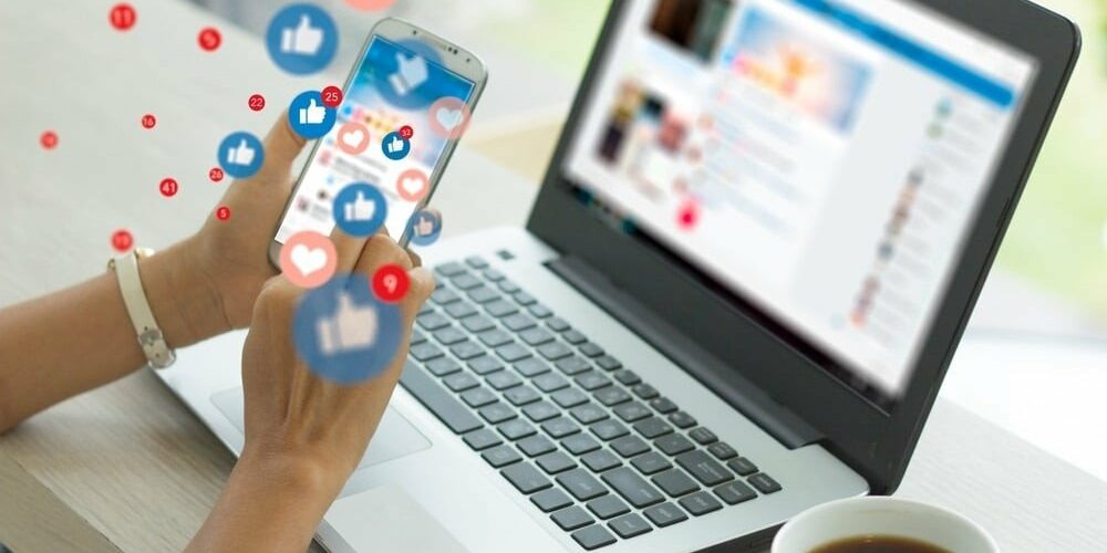 Social media manager checking mobile phone