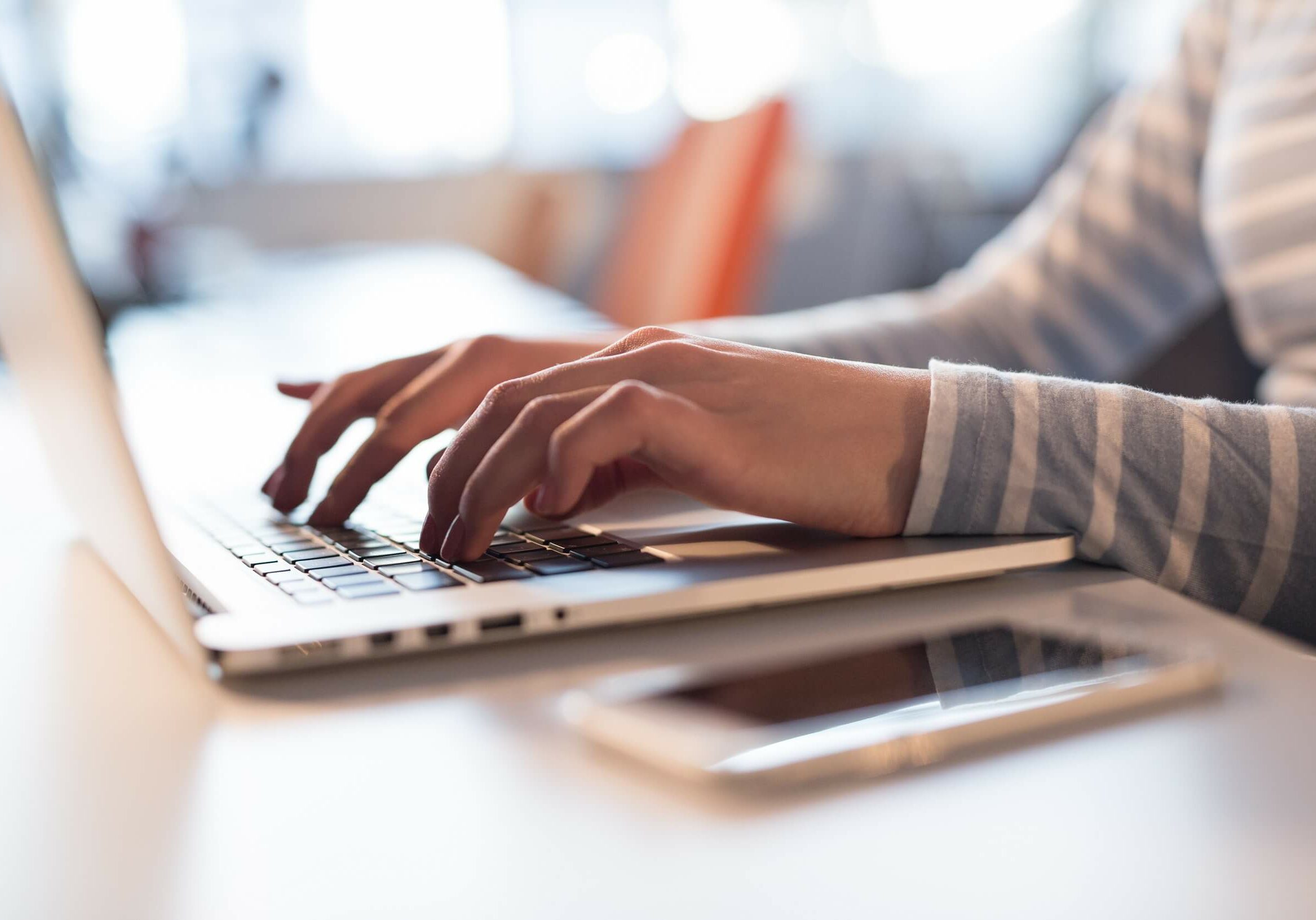 Young female Entrepreneur Freelancer Working Using A Laptop In Coworking space